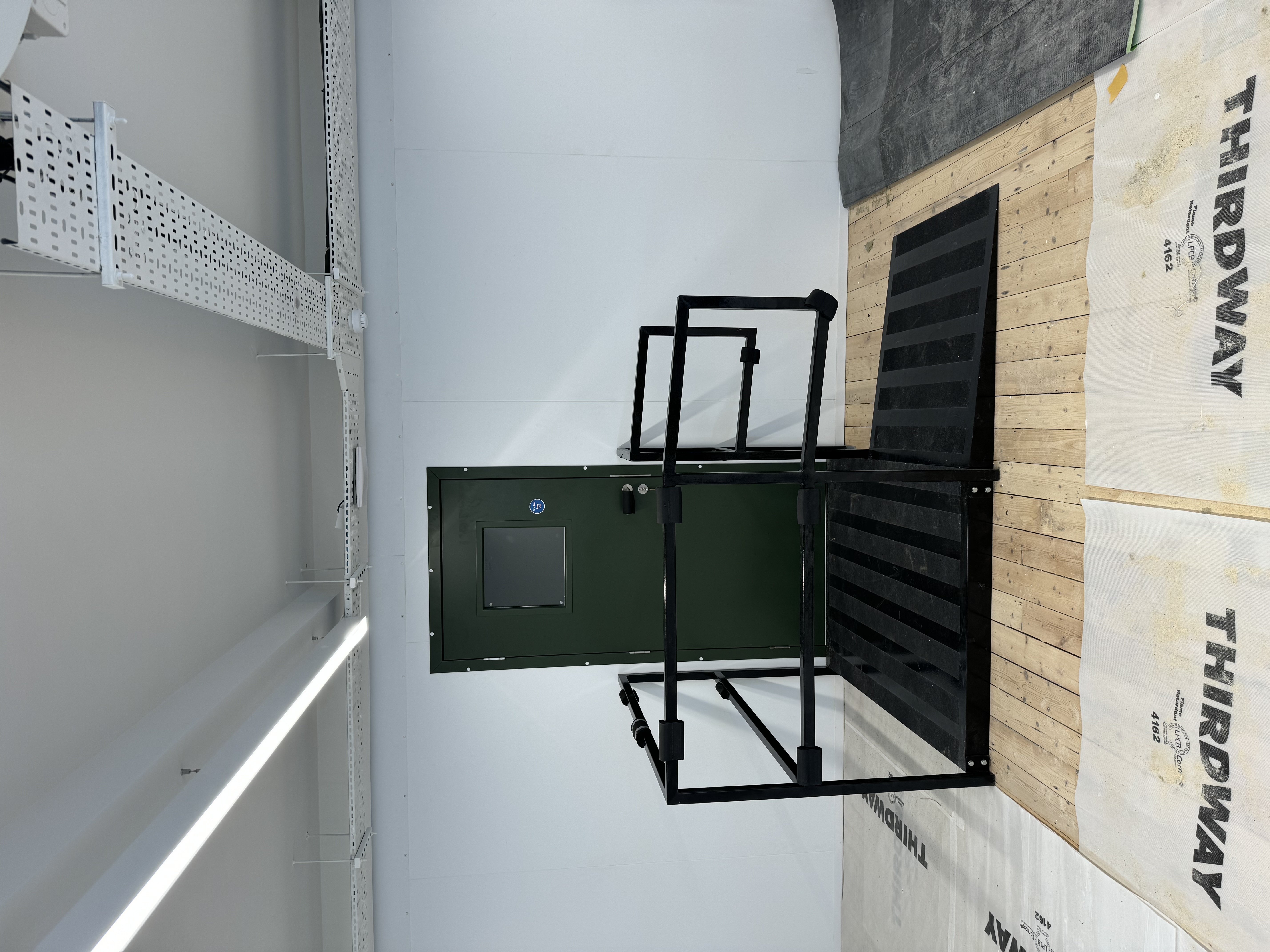 Industrial access door with safety gate within coldstore